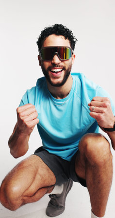 Fitness, fashion and man with sunglasses, excited or fist pump for win, happy or aesthetic in...