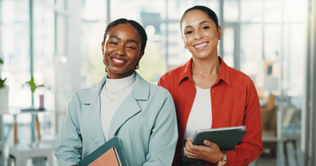 Portrait, creative and women with tech, office or happy for story opportunity, journalists and team. Confident, reporters and people with smile for career growth, media and collaboration in newsroomの写真素材