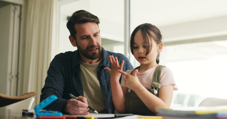 Homework, counting and dad with girl in home for maths lesson, learning and help with activity. Family, numeracy and father with child, books and education for studying and numbers on hands in houseの写真素材
