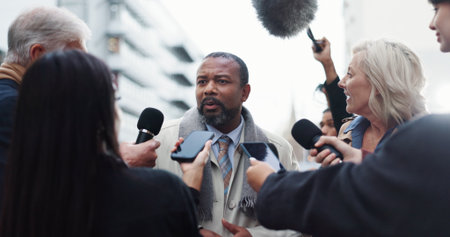 Politician, man or discussion with reporter for election announcement, campaign opinion and reaction. Mayor candidate, people and media for politics event, qna and vote results statement in New Yorkの写真素材