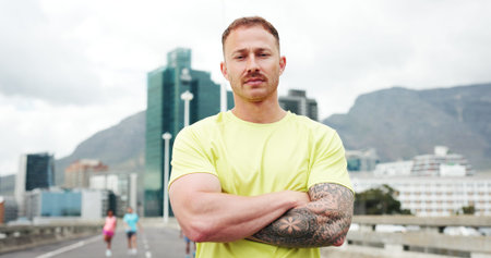 Confident, fitness and portrait of man in city with crossed arms for exercise, training and workout....