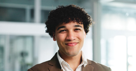 Happy, professional and portrait of businessman in office with confidence for finance internship. Smile, graduate program and male financial advisor with pride for job opportunity in workplace.の写真素材