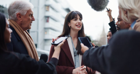 Woman, spokesperson and interview with press, city and journalists with election questions and talk. Happy, representative and outdoor with reporters for campaign updates, media and people with micの写真素材