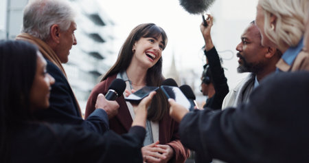 Woman, publicist and press with questions, city and discussion with reporters for election interview. Happy, representative and outdoor with journalists for campaign updates, news and people with micの写真素材