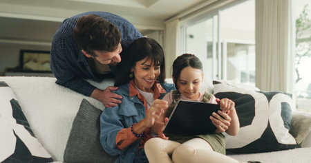 Tablet, happy and parents with child on sofa in home for watching series, movie or video on app....