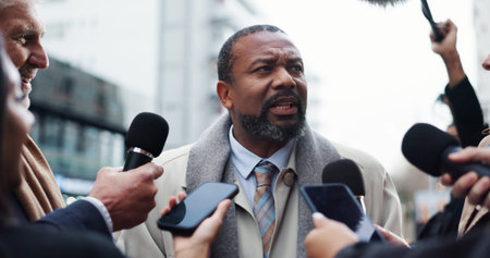 Politician, man or interview with reporter for election announcement, campaign opinion or reaction. Political leader, people and media for politics discussion, question or mayor feedback in New York.の写真素材