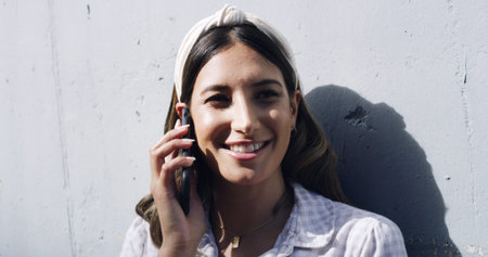 Outdoor, phone call and woman with smile, networking and discussion with contact for gossip or chat....