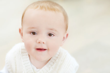 Portrait, home and baby boy with smile, relax and space with growth, facial expression and youth....