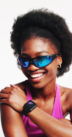 Athlete, fashion and woman with sunglasses, happy or UV protection with goggles for glare reduction. White background, studio and black person with blue tint eyewear and visual shield for eye careの写真素材