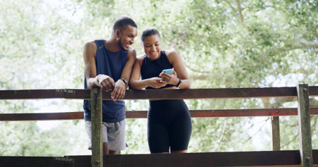 Hiking, nature or couple with phone on bridge, outdoor exercise or digital map for trail navigation....
