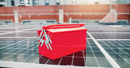 Empty, tool box and solar panel on rooftop for maintenance, installation and photovoltaic repairs....