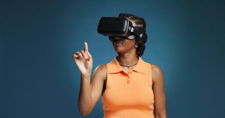 Interface, metaverse and vr headset for black woman in studio for immersive experience. Gaming,...