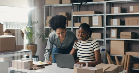 Ecommerce, people and discussion with laptop for online order info, logistics email and mentorship. Team, talking and research in office with computer for planning, shipping or supply chain training.の写真素材