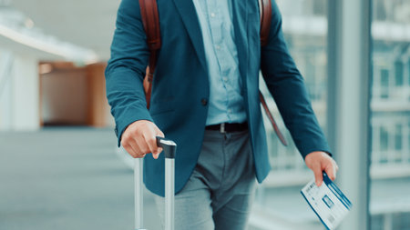 Person, hands or travel with suitcase in airport for business journey, work trip or commute. Ticket, employee or traveler with luggage or international boarding pass for departure or job opportunityの写真素材
