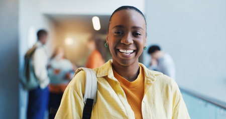 College, portrait or woman in hallway with smile, knowledge or scholarship in study opportunity. Happy, bag and student in university with confidence, education and pride in academic funding.の写真素材