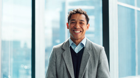 Journalist, portrait or man in agency with smile, experience or pride in media job. Happy, professional or male person in newsroom with confidence, press or career growth in publishing industry.の写真素材