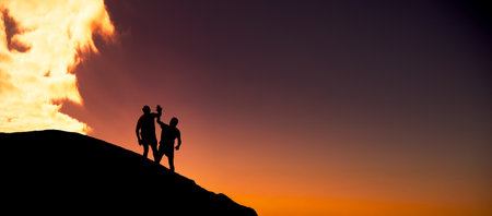 Team, fitness and high five with silhouette of people in nature for runner, support and health partner. Success, exercise and wellness with friends outdoor at sunset for training, athlete and spaceの写真素材