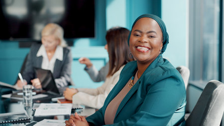 Portrait, woman and lawyer in boardroom with smile for legal aid, labor law and legislation advice. Confident, female person and team in workplace for advocacy meeting, employment rights.の写真素材