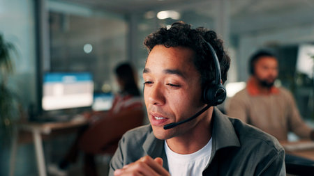 Headset, talking and businessman in office at night with communication, crm or contact us. Mic, call...