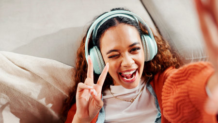 Woman, influencer and peace sign with headphones for streaming, photography or profile picture in...