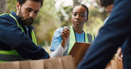 Clipboard, volunteer and counting with woman in park for donation, community service and ngo...