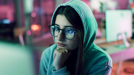 Night, woman with computer for encryption, firewall or cybersecurity. Confidential info, system access or programmer in dark data center, tech reflection or spywareの写真素材