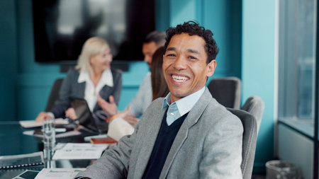 Portrait, man and lawyer in boardroom with smile for legal aid, labor law and legislation compliance. Happy, person and team in office for advocacy meeting, employment rights or constitution advice.の写真素材