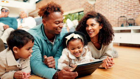 Parents, children and tablet on floor, happy and bonding with care, love and online game in family house. People, mother and father with kids, tech and application for learning in living room at homeの写真素材