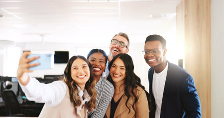 Selfie, law firm and project in office with smile, confidence and management for group of business people. Profile picture, social media and lawyer with legal team, support and agency for advocateの写真素材