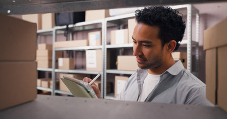 Ecommerce, tablet and stylus with man in warehouse for courier inspection, shipping and supply chain. Online checklist, quality assurance and inventory management with person for distributionの写真素材