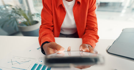 Hands, phone and business woman typing in office for online website, investment research and internet. Closeup, corporate and person on smartphone for connection, scroll mobile app and financial newsの写真素材