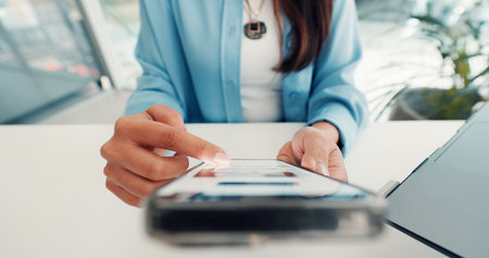 Hands, phone and business woman scroll in office for online website, investment research and internet. Professional, corporate and person on smartphone for connection, mobile app and financial newsの写真素材