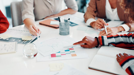 Hands, people and meeting with graphs on document for accounting, finance report and sales stats. Staff, teamwork or paperwork with data analysis, financial analytics and profit growth of company kpiの写真素材