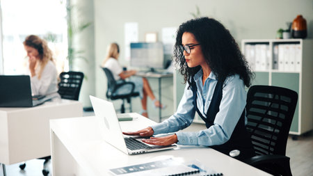 Laptop, hand pain and business woman in office with injury, stress or arthritis. Computer, sore fingers and person in workplace with carpal tunnel syndrome, fibromyalgia and coworking with discomfortの写真素材