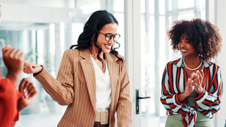 Happy, women or applause in office with success for fashion designer award, goal or achievement. People, clapping or celebration in workplace for clothing collection sale, accomplishment or milestoneの写真素材