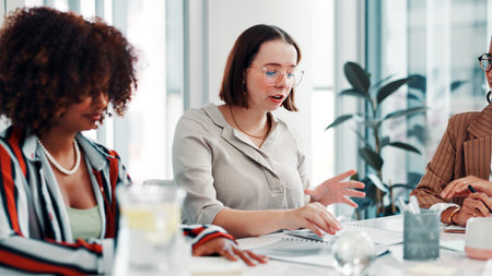 Brainstorming, meeting or people in boardroom for discussion, campaign schedule or release date decision. Teamwork, suggestion or women with idea for launch agenda, brand awareness or plan promotionの写真素材