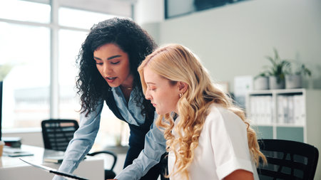 Business, women and meeting with folder in office for training, proofreading article and feedback. People, mentorship and team with manuscript, draft update and headline advice for story publicationの写真素材