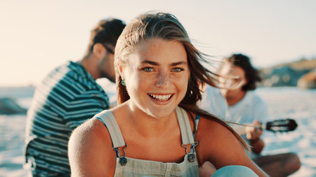 Beach, portrait and travel with woman outdoor in nature for bonding, friends trip or summer fun. Break, smile and vacation with group of happy people on shore at coast for holiday or weekend getawayの写真素材