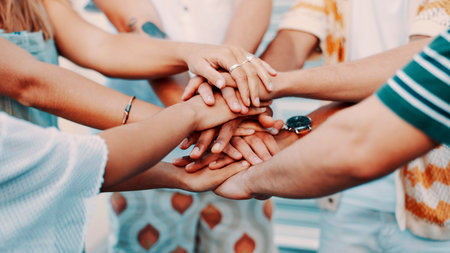 Hands stack, outdoor and people with support, teamwork and unity with community. Closeup, friendship and group with gesture, solidarity and cooperation with trust, motivation and collaborationの写真素材