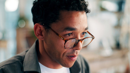 Glasses, programmer or man with concentration in office for update deadline, system check or maintenance. Tech reflection, reading or engineer with server development, project or software reviewの写真素材