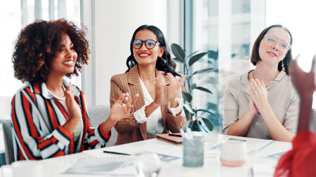 Applause, collaboration and fashion design with business women in boardroom for bonus or goals. Clapping, milestone and success with happy designer people at table in workplace for clothing companyの写真素材