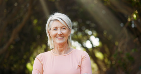 Smile, fitness and portrait of old woman in nature for runner, confidence and health. Retirement,...