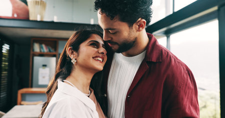 Home, smile and couple with connection for love, care or marriage commitment for loyalty. Romance, happy man and woman in living room together for healthy relationship, support or trust with partnerの写真素材