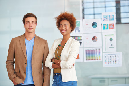 Startup, happy and portrait of business people in office for digital marketing, planning and branding. Team, creative agency and man with woman with graph, about us and pride for campaign projectの写真素材