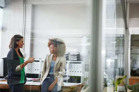 Meeting, planning and business women in office for budget review, finance report and proposal. Teamwork, accounting and people in discussion for financial project, company revenue and collaborationの写真素材