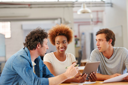 Creative, tablet and business people in office for meeting for article ideas, submission and...