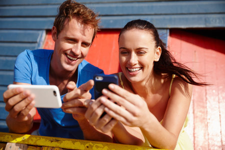Phone, happy and couple at beach with social media, networking or communication on mobile app....