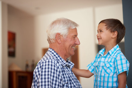 Smile, grandfather and talking with kid at house for love, affection and emotional support. Senior...