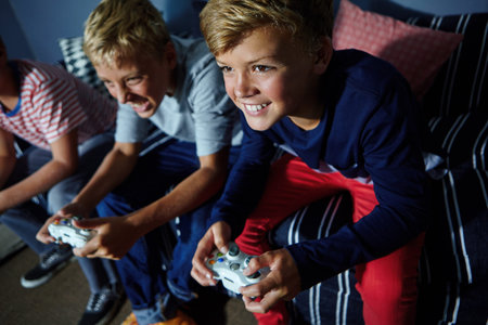 Video games, challenge and teens on sofa in home with friends, playing and online entertainment....