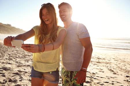 Outdoor, couple and selfie on vacation, sea and bonding with picture, laughing or together in...